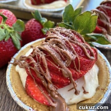 A mini strawberry pie with chocolate on top