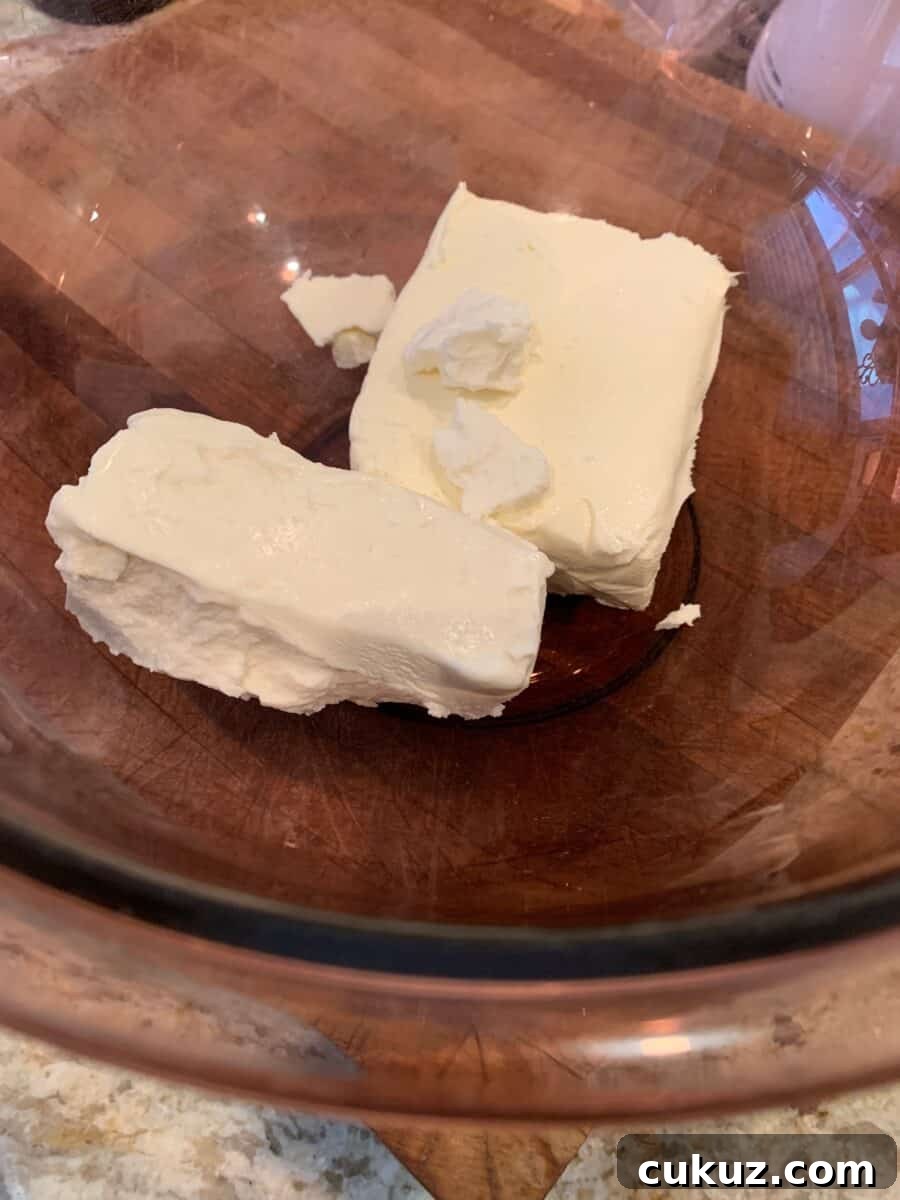 Goat cheese and cream cheese in a glass bowl.