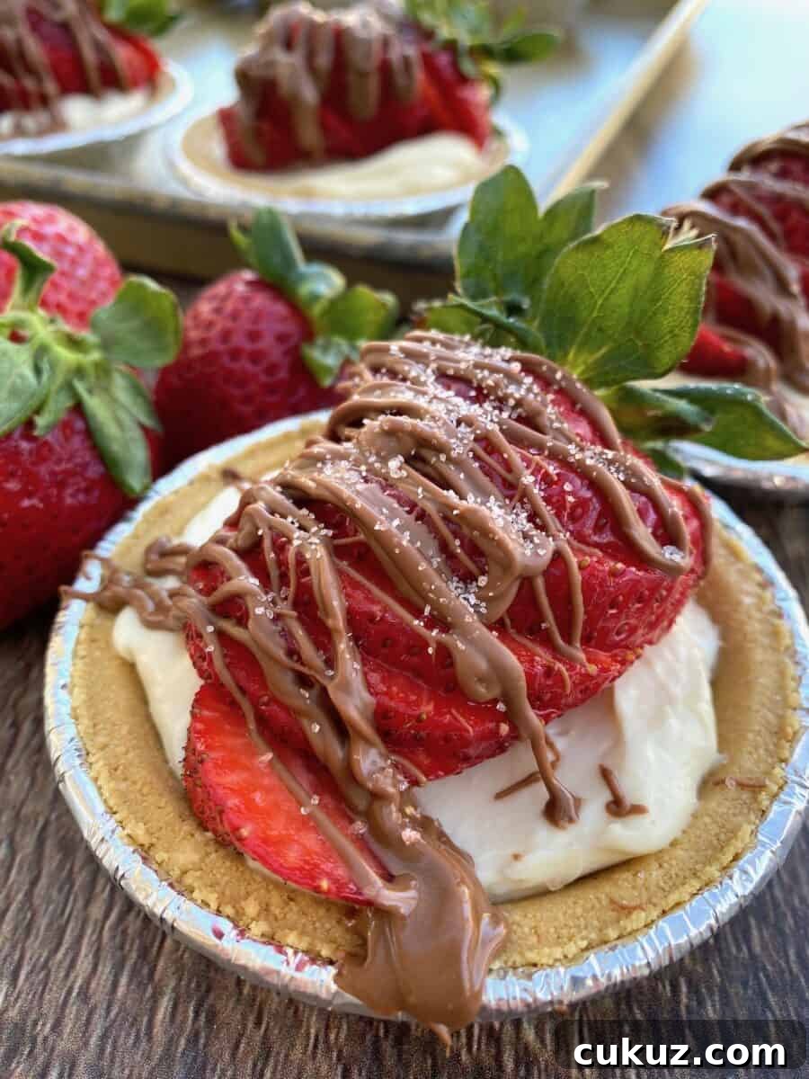 A mini strawberry pie with chocolate on top