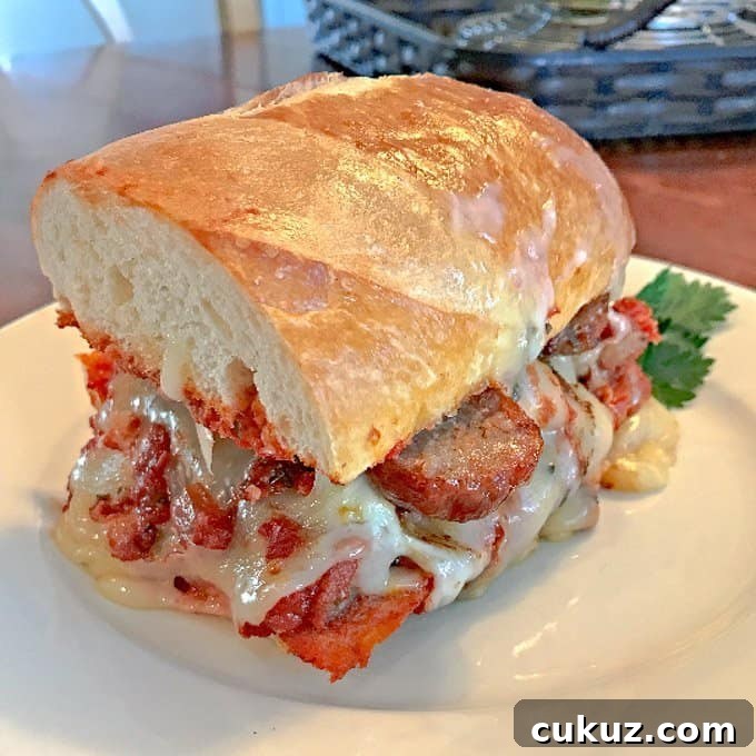 The Bomb Italian Sausage Sandwich on white plate