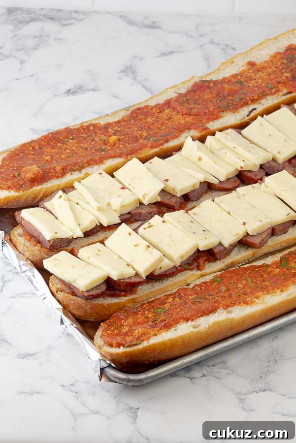The Bomb Italian Sausage Sandwich being prepared on a cookie sheet before being baked