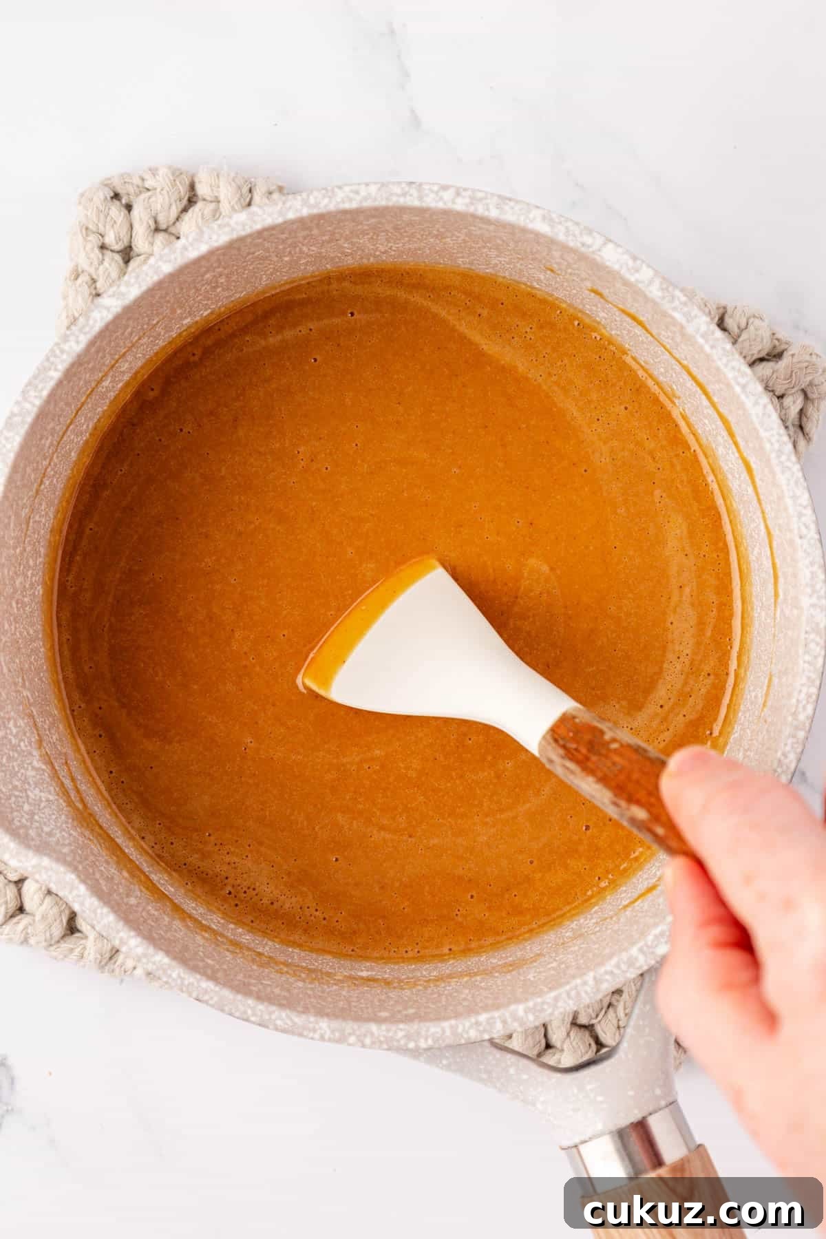 Stirring melted peanut butter mixture