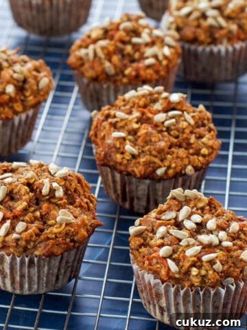 healthy morning glory muffins on a wire rack