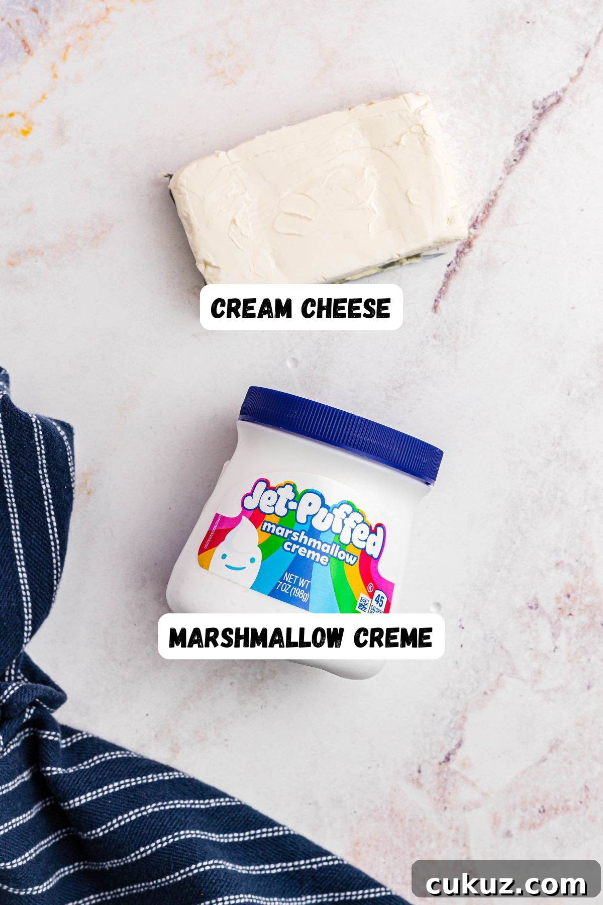 Marshmallow creme and cream cheese on a marble table.